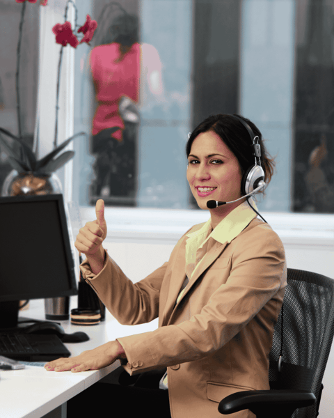 woman showing thumbs up while talking